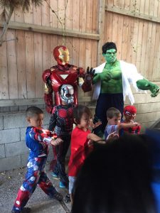 hulk and iron man with kids at birthday party