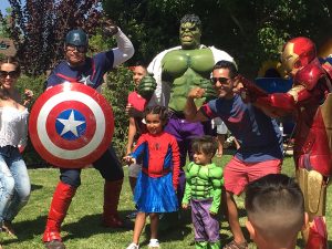 avengers captain america hulk and iron man pose for pictures with kids at a birthday party
